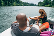 © Inti St. Clair - Dad and daughter on boat in lake surrounded by trees