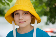 Girl Wearing A Yellow Rain Hat In Backyard Just In Case It Rains 