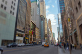Fototapeta Miasto - Street view of light traffic in a New York City street. Shot with manual Tilt Shift lens for selective focus effect.