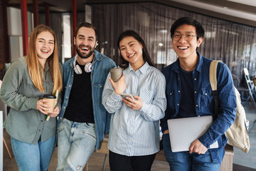 Sticker - Photo of multinational cheerful students laughing and looking at camera