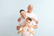 © Pixel-Shot - Man with his father and son on color background