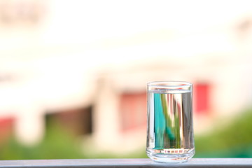 Poster - Water in glass on counter background and space for text 