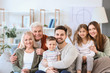 © Pixel-Shot - Big family spending time together at home