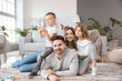 © Pixel-Shot - Happy family spending time together at home