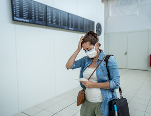 Wall Mural - Traveler with mask stuck in airport no able to return home country due to COVID-19 border closures.