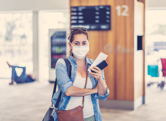 Wall Mural - Traveler with mask stuck in airport no able to return home country due to COVID-19 border closures.