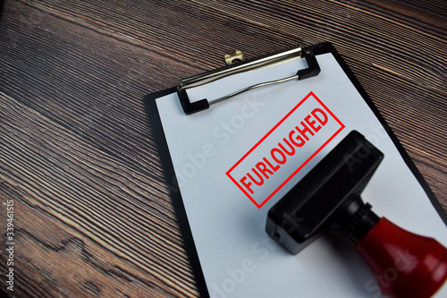 Cuadros en Lienzo Red Handle Rubber Stamper and Furloughed text isolated on the table