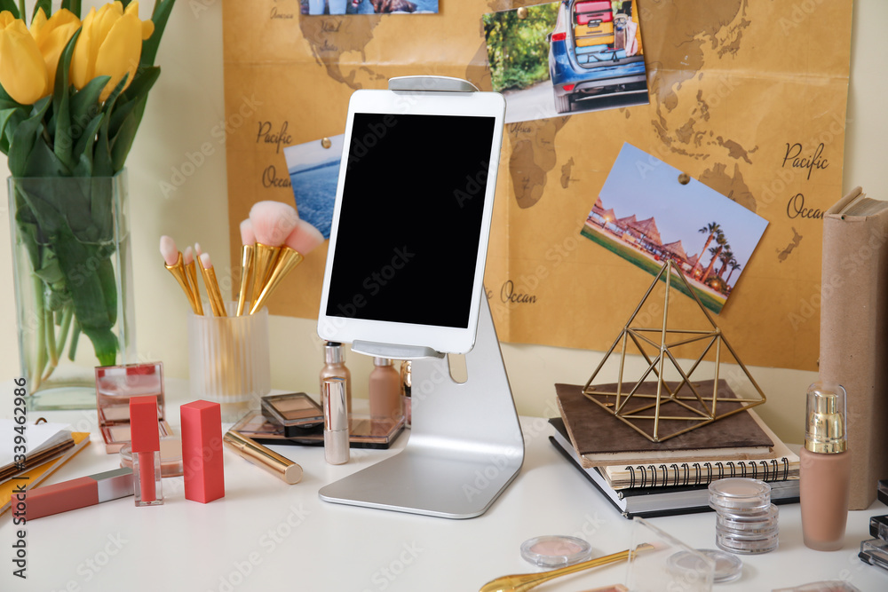 Workplace of professional makeup artist with tablet computer