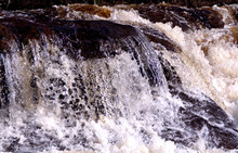 Fresh Waterfall, White Water With Stones In Close Up Scenic. The Picture Is Taken In Bollebygd, Sweden.