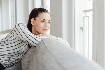 Attractive young woman relaxing on a couch