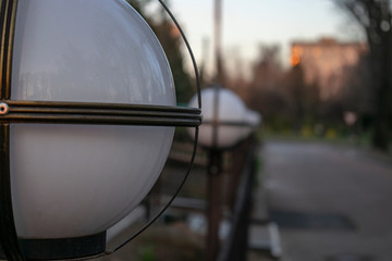 Street round lamp of white color. Street lamp close-up