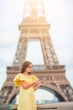Beautiful woman in Paris background the Eiffel tower during her vacation