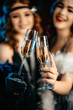 © kohanova1991 - Beautiful flappers women dressed in style of Roaring twenties drinking champagne. Vintage, retro party, fashion, girls friends concept