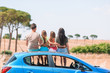 Parents and two little kids on summer car vacation