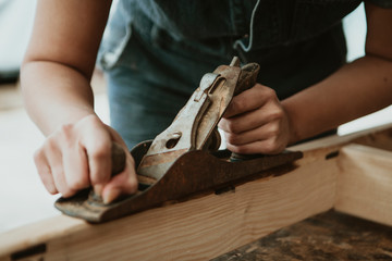 Carpenter shaving wood