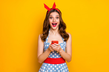 Poster - Portrait surprised energetic blogger girl use cell phone read social network news impressed scream wow omg wear blue polka-dot retro style outfit isolated bright shine color background