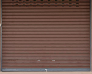 Canvas Print - brown shutter steel door of house background.