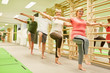© Robert Kneschke - Group of seniors doing balance exercise on one leg
