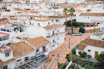 Wall Mural - A town in the south of Spain with small white houses and narrow streets. Quarantine in Europe due to the epidemic Covid-19, deserted streets, view from above.