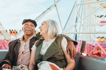 Happy senior couple on a Ferris wheel