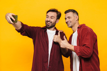 Wall Mural - Two attractive young men friends wearing casual clothes