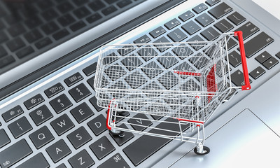 shopping cart on a notebook keyboard. online shopping