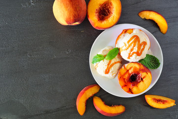 Aufkleber - Summertime grilled peaches with vanilla ice cream and caramel sauce. Overhead view table scene on a dark slate background with copy space.