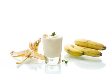 Wall Mural - tasty homemade yogurt with bananas in a glass isolated on white background