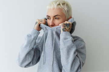 Model wearing gray hoodie