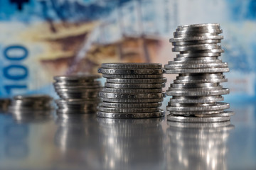 A row of piles of Swiss coins