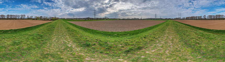 Wall Mural - 360° agriculture fields view from a protective dam