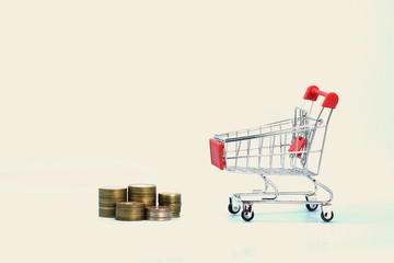 Shopping cart with Russian money. Metal coins and a souvenir shopping basket.