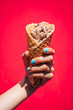 © Inti St. Clair - Close up of girl's hand holding ice cream cone