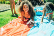 © Inti St. Clair - Girls playing on slip and slide in front yard of home