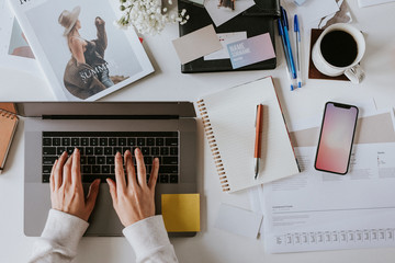 Fashion blogger using a laptop