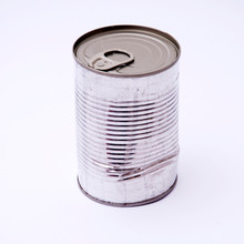 Close-up Of Dented Can Against White Background