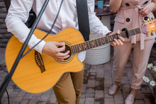 Musician Playing Guitar On Wedding Party.