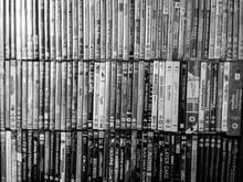 Full Frame Shot Of Compact Discs In Shelf At Home