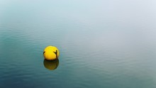 Yellow Buoy At Sea