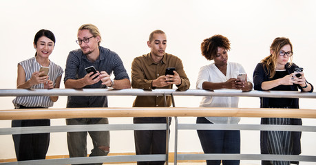 Wall Mural - Group of diverse people using smartphones