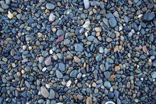 High Angle View Of Wet Pebbles And Stones