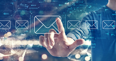 Email concept with a man on blurred city background