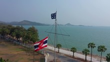 The Royal Thai Navy Flag Flutters Atop The Flagpole.
