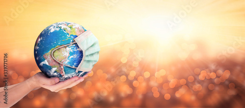 Fotomural Earth Day concept: Corona virus or COVID-19 Earth wearing a mask , this image fu