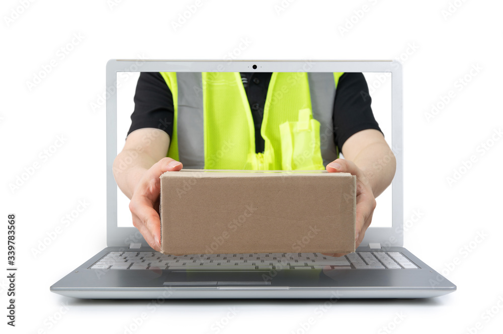 Delivery man delivering a parcel comes out from a screen of a laptop ...