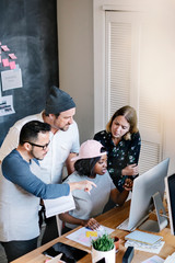 Wall Mural - Diverse startup team working together