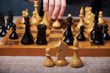 Businessman hand moving of playing chess strategyconcept: symbol confident new strategy plan for win and success, sports game thinking battle planning object achievement queen for successful