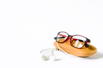 eyeglass placed on its wooden case