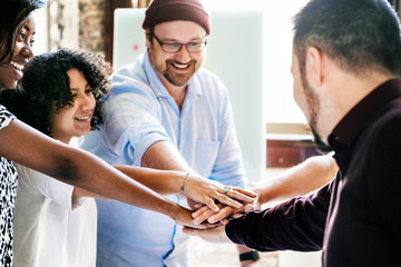 Wall Mural - Diverse startup business team stacking hands