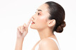 © sopradit - Beauty asian women  touching nose portrait face with natural skin and skin care healthy hair and skin close up face beauty portrait.Beauty Concept on white background.